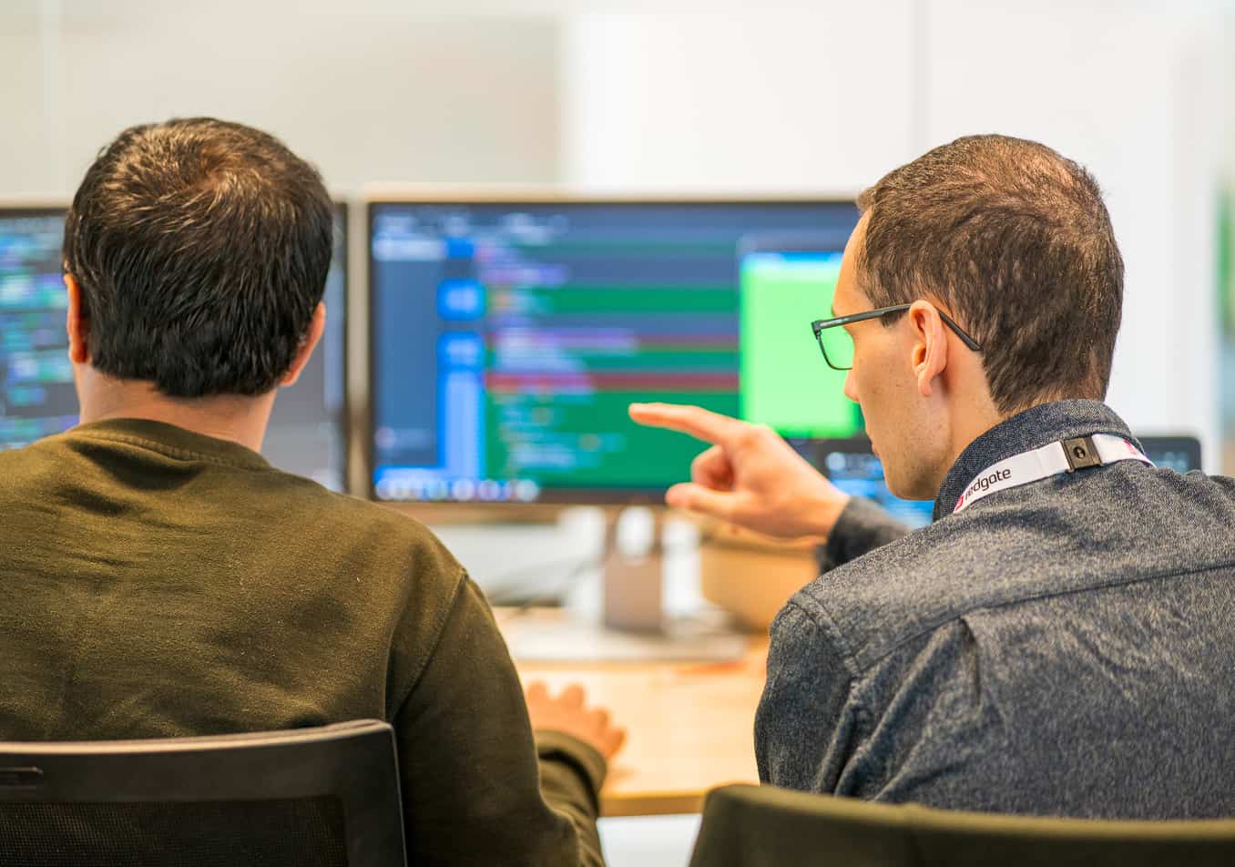 Two developers working together on a coding problem