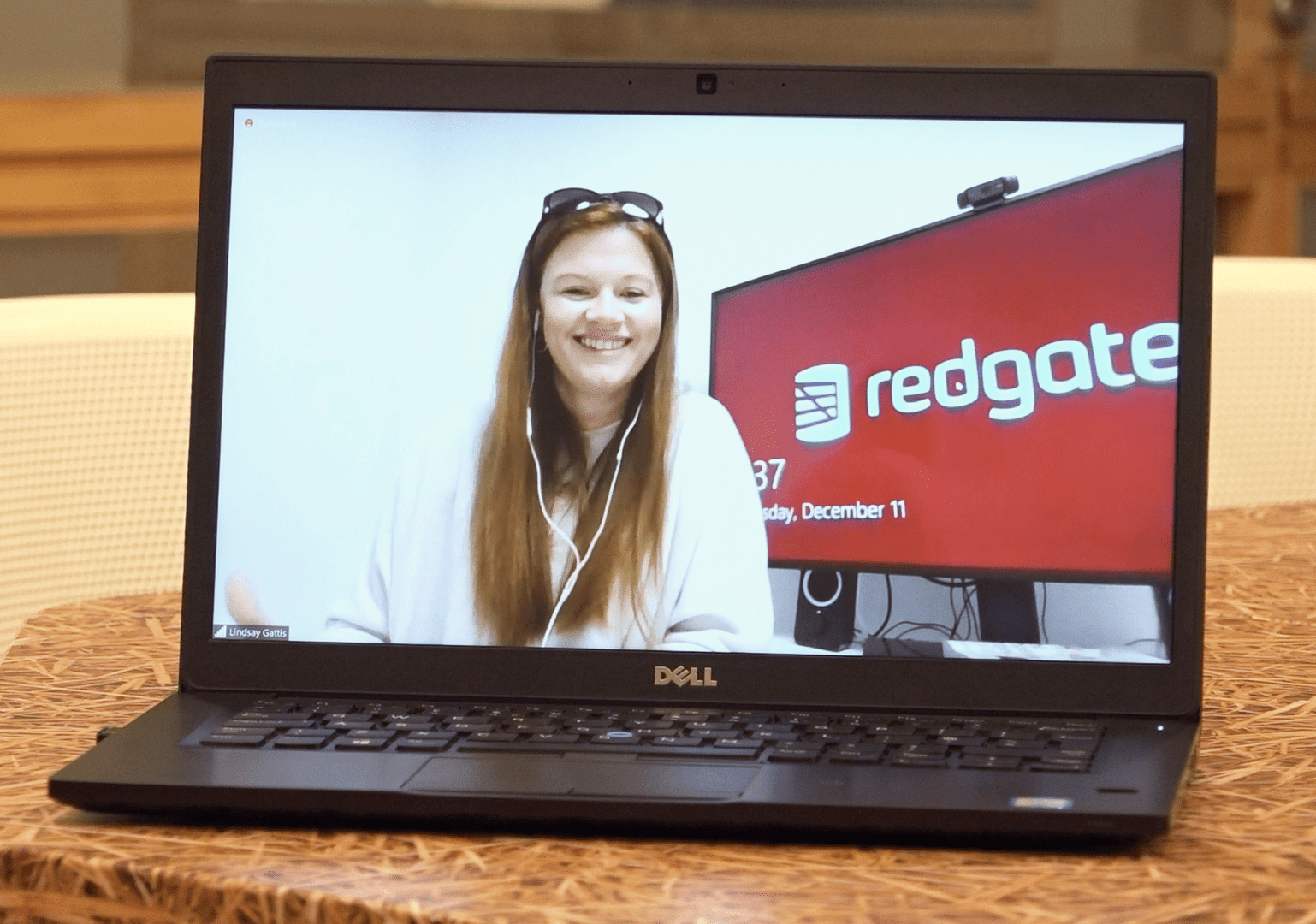 A remote worker on a laptop screen